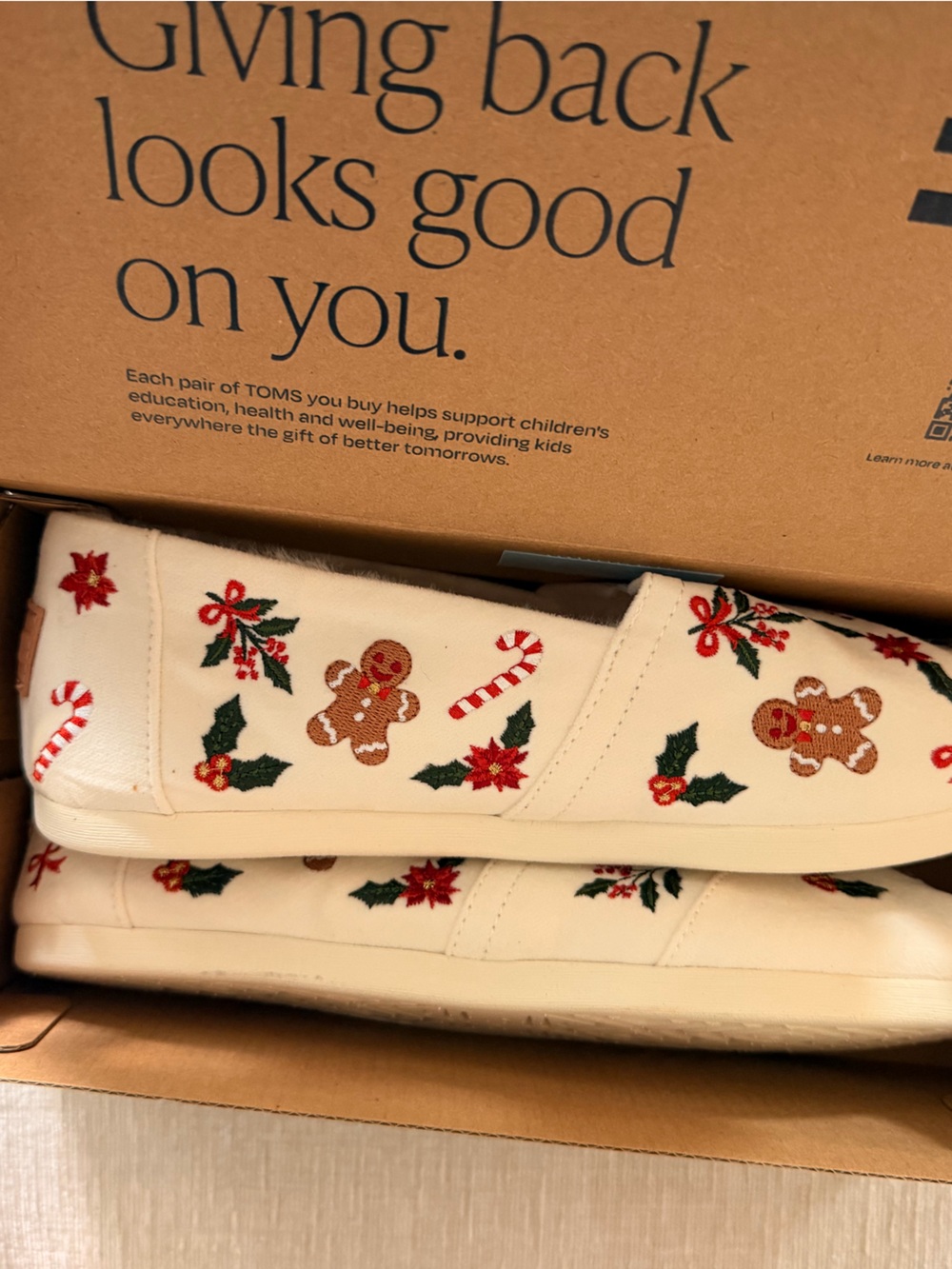 TOMS Women’s Cream Slip-On Shoes with Holiday Embroidery